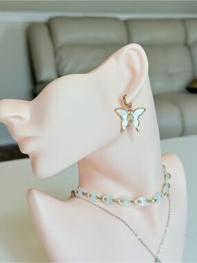 Gold Butterfly Drop Earrings in White Enamel